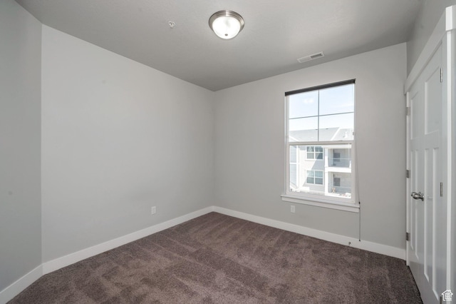 55 W Silver Springs Dr Unit F, Vineyard, UT 84059 - spare room featuring dark carpet and baseboards