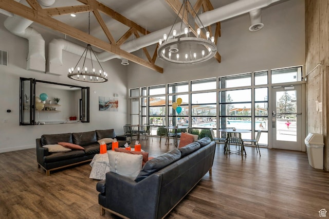 55 W Silver Springs Dr Unit F, Vineyard, UT 84059 - living room featuring a towering ceiling, a chandelier, wood finished floors, and beamed ceiling