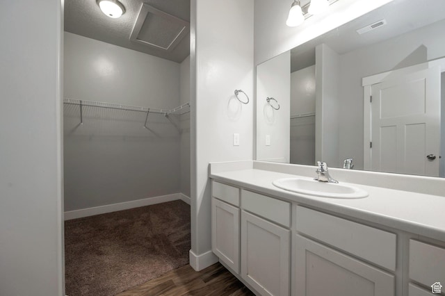 55 W Silver Springs Dr Unit F, Vineyard, UT 84059 - bathroom featuring vanity, wood finished floors, and a walk in closet