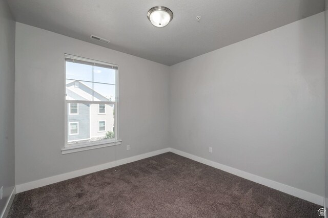55 W Silver Springs Dr Unit F, Vineyard, UT 84059 - empty room with dark colored carpet and baseboards
