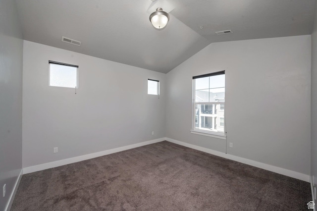 55 W Silver Springs Dr Unit F, Vineyard, UT 84059 - spare room with lofted ceiling and dark carpet