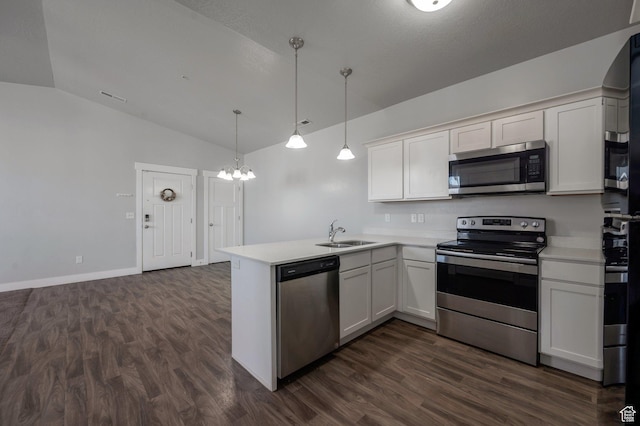 55 W Silver Springs Dr Unit F, Vineyard, UT 84059 - kitchen with appliances with stainless steel finishes, vaulted ceiling, a peninsula, light countertops, and dark wood-style floors