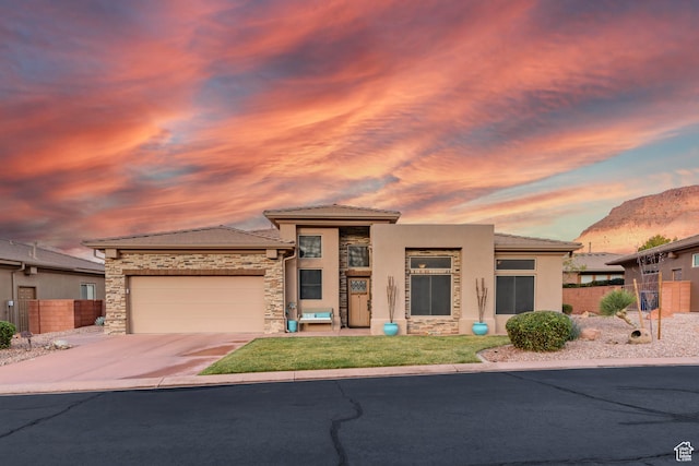 250 N Snow Canyon Dr Unit 16, Ivins, UT 84738 - prairie-style home featuring a garage, concrete driveway, stucco siding, stone siding, and a tiled roof