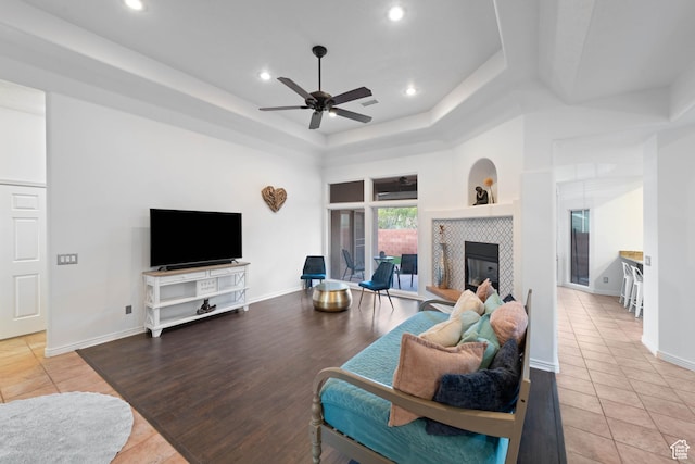 250 N Snow Canyon Dr Unit 16, Ivins, UT 84738 - living area featuring a raised ceiling, a ceiling fan, light tile patterned flooring, a tile fireplace, and recessed lighting