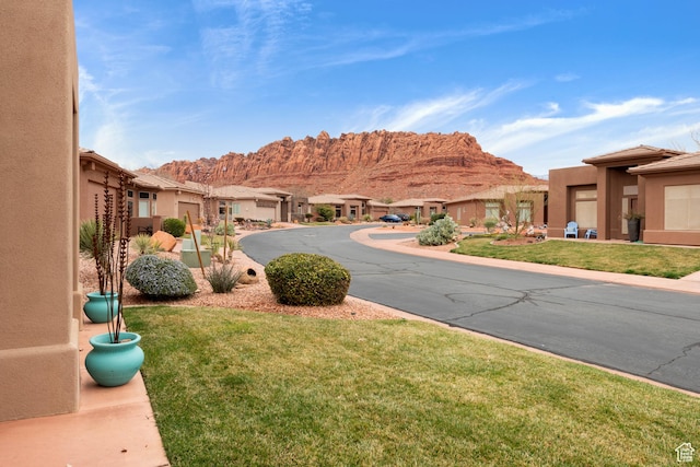250 N Snow Canyon Dr Unit 16, Ivins, UT 84738 - view of asphalt road with a mountain view and a residential view