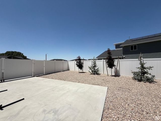 3052 N Mountain Rd, North Ogden, UT 84414 - fenced backyard with a patio area