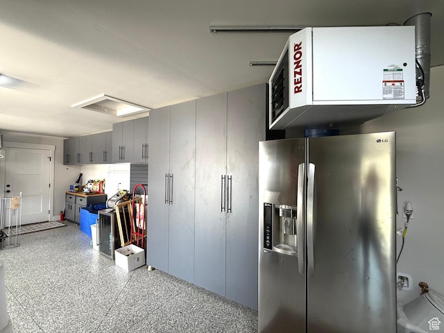3052 N Mountain Rd, North Ogden, UT 84414 - garage with stainless steel refrigerator with ice dispenser and a heating unit