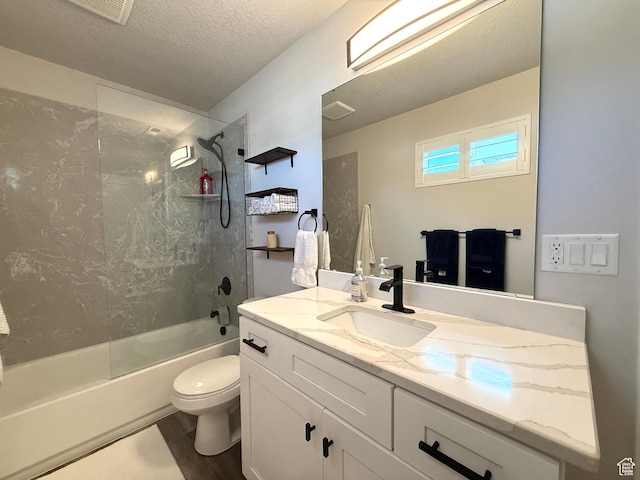 3052 N Mountain Rd, North Ogden, UT 84414 - bathroom featuring vanity, tub / shower combination, wood finished floors, and a textured ceiling