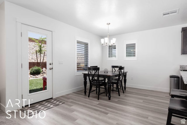 6297 S Zelda Dr, St George, UT 84790 - dining area featuring a chandelier, plenty of natural light, and light wood-style flooring