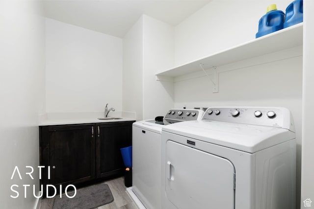 6297 S Zelda Dr, St George, UT 84790 - laundry room featuring cabinet space, washer and dryer, and light wood finished floors