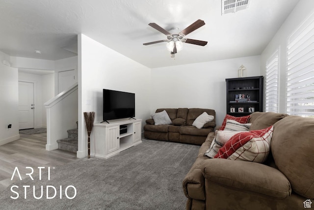 6297 S Zelda Dr, St George, UT 84790 - living area with a ceiling fan, stairs, light carpet, and light wood-type flooring