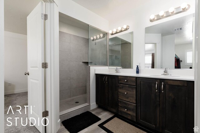 6297 S Zelda Dr, St George, UT 84790 - bathroom with double vanity, walk in shower, and wood finished floors