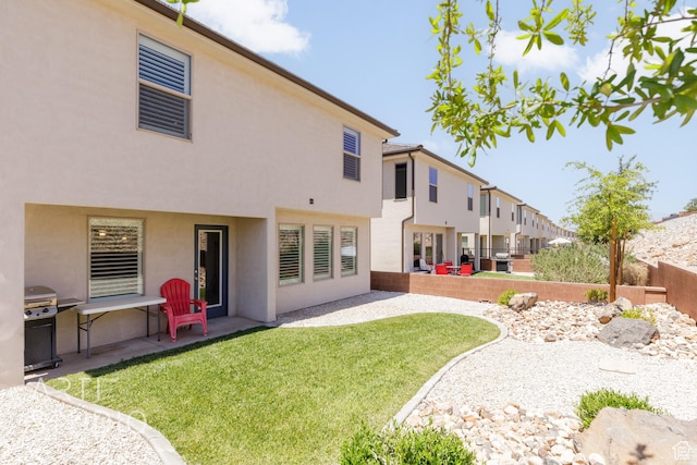 6297 S Zelda Dr, St George, UT 84790 - back of property featuring stucco siding and a patio