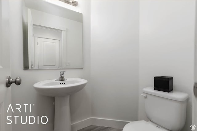 6297 S Zelda Dr, St George, UT 84790 - half bathroom with toilet and wood finished floors