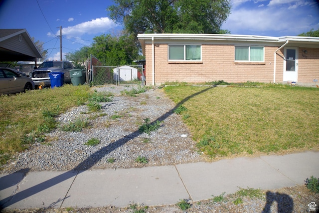 2617 S Ridgeland W, West Valley City, UT 84119 - view of side of property featuring a gate and brick siding