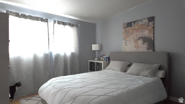 2617 S Ridgeland W, West Valley City, UT 84119 - bedroom with wood finished floors and vaulted ceiling