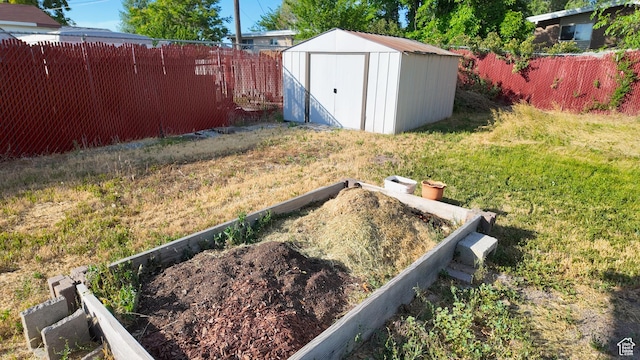 2617 S Ridgeland W, West Valley City, UT 84119 - fenced backyard with a storage shed and a vegetable garden