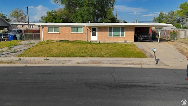 2617 S Ridgeland W, West Valley City, UT 84119 - ranch-style home featuring concrete driveway, an attached carport, brick siding, and crawl space