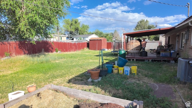 2617 S Ridgeland W, West Valley City, UT 84119 - fenced backyard featuring a storage shed and a deck