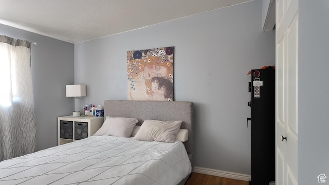 2617 S Ridgeland W, West Valley City, UT 84119 - bedroom with wood finished floors and baseboards