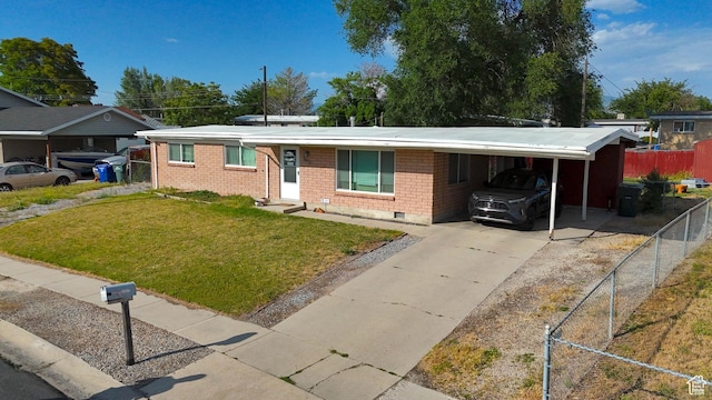 2617 S Ridgeland W, West Valley City, UT 84119 - ranch-style home with concrete driveway, a carport, and brick siding