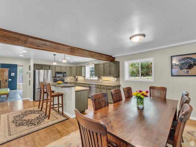 789 Richmond Dr, Park City, UT 84098 - dining space featuring light wood finished floors, plenty of natural light, recessed lighting, and beam ceiling