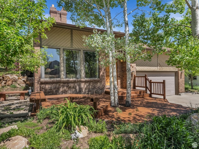 789 Richmond Dr, Park City, UT 84098 - mid-century home featuring concrete driveway, a chimney, and brick siding