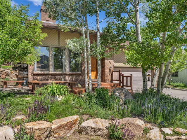 789 Richmond Dr, Park City, UT 84098 - view of front of home with a chimney, a garage, and concrete driveway
