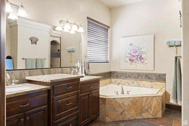 1883 S Purple Sage Dr, Washington, UT 84780 - full bathroom with two vanities, a garden tub, and stone tile flooring