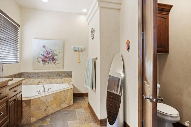 1883 S Purple Sage Dr, Washington, UT 84780 - bathroom featuring stone tile floors, a garden tub, vanity, and recessed lighting