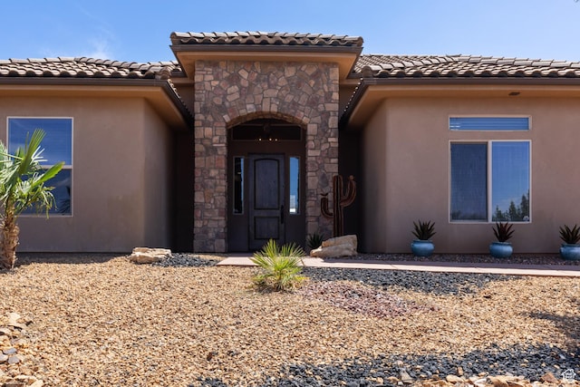 1883 S Purple Sage Dr, Washington, UT 84780 - entrance to property with a tile roof, stone siding, and stucco siding
