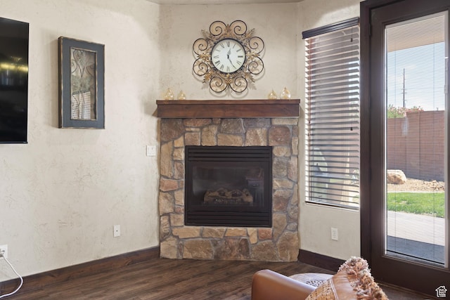 1883 S Purple Sage Dr, Washington, UT 84780 - living area featuring wood finished floors, plenty of natural light, a fireplace, and a textured wall