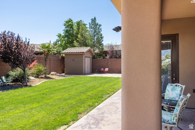1883 S Purple Sage Dr, Washington, UT 84780 - fenced backyard featuring a storage shed and a patio area
