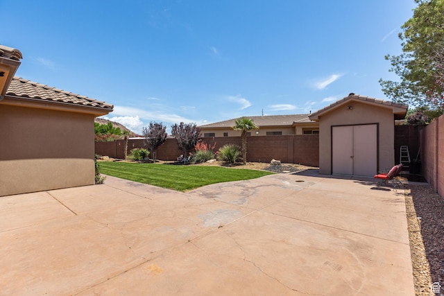 1883 S Purple Sage Dr, Washington, UT 84780 - fenced backyard with a storage shed and a patio