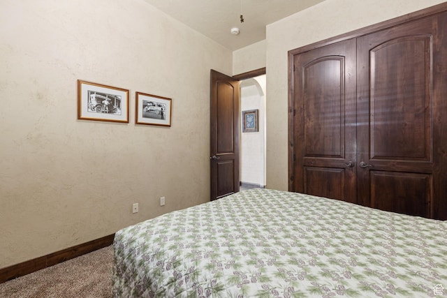 1883 S Purple Sage Dr, Washington, UT 84780 - carpeted bedroom featuring arched walkways and baseboards