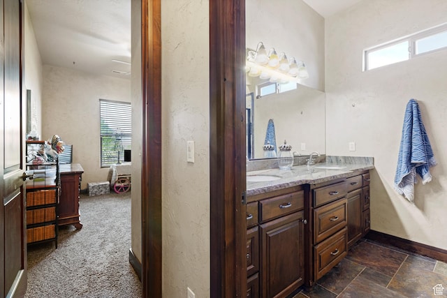 1883 S Purple Sage Dr, Washington, UT 84780 - full bathroom featuring double vanity and plenty of natural light