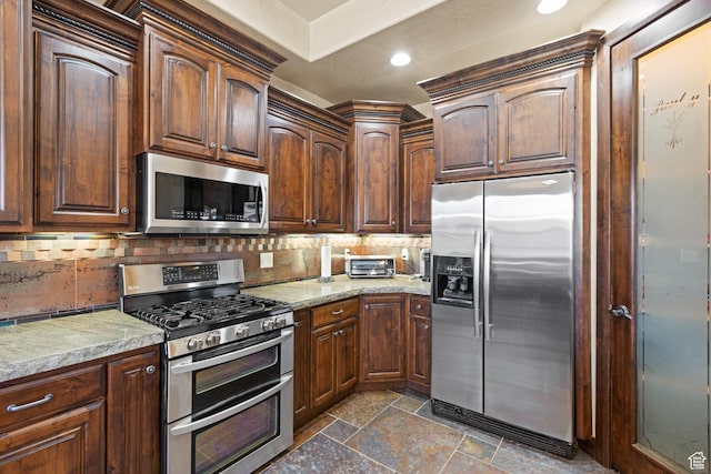 1883 S Purple Sage Dr, Washington, UT 84780 - kitchen featuring stainless steel appliances, stone tile flooring, backsplash, light stone counters, and recessed lighting