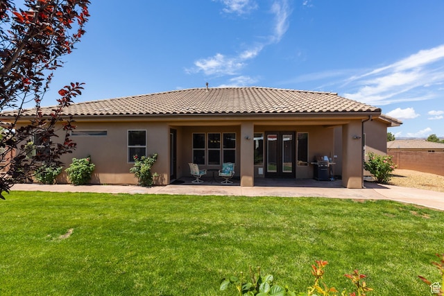 1883 S Purple Sage Dr, Washington, UT 84780 - rear view of property featuring a tile roof, stucco siding, and a patio area