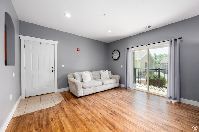 136 W Spring Hill Way Unit 801, Saratoga Springs, UT 84045 - living room with arched walkways, light wood-type flooring, and recessed lighting