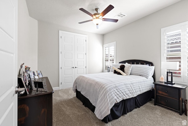 2723 S Varano Way, St George, UT 84770 - bedroom featuring light carpet, a closet, and a ceiling fan