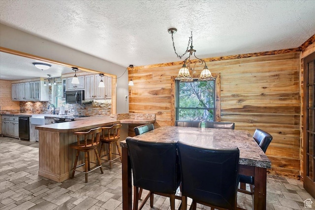 409 N 9000 E, Huntsville, UT 84317 - dining space featuring a textured ceiling and wood walls
