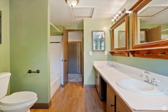 409 N 9000 E, Huntsville, UT 84317 - full bath featuring wood finished floors, a textured ceiling, double vanity, and shower / bathtub combination with curtain
