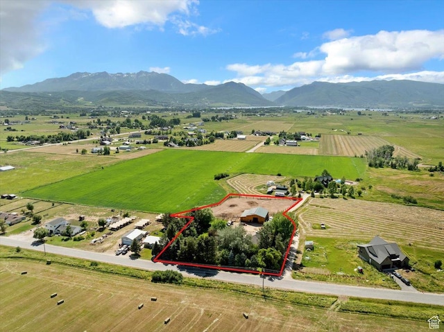 409 N 9000 E, Huntsville, UT 84317 - overview of rural landscape with property parcel outlined, a mountainous background, and extensive farmland