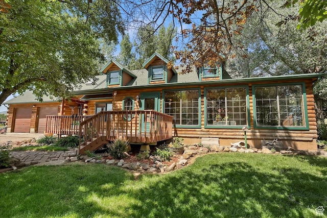 409 N 9000 E, Huntsville, UT 84317 - back of property with a lawn, concrete driveway, a wooden deck, and an attached garage