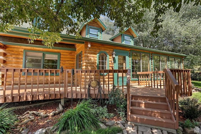 409 N 9000 E, Huntsville, UT 84317 - view of front of property with a sunroom, a deck, and log exterior