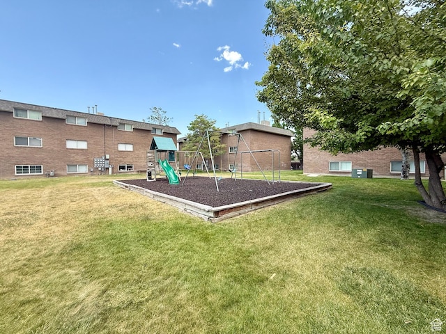 3677 S 2200 W Unit 41, West Valley City, UT 84119 - view of green lawn featuring a playground