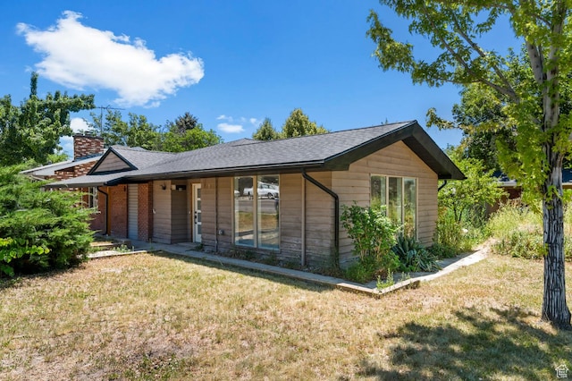 2317 N Timpview Dr E, Provo, UT 84604 - ranch-style house featuring a front lawn and a chimney