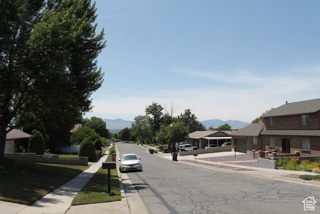 1268 E Edenbrook Dr, Sandy, UT 84094 - view of asphalt road featuring sidewalks, curbs, and a mountain view