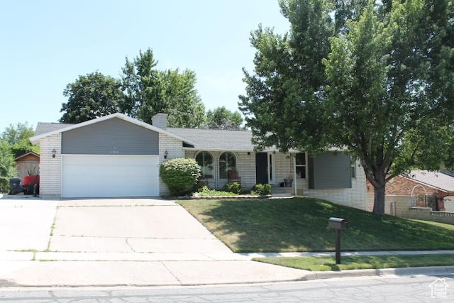 1268 E Edenbrook Dr, Sandy, UT 84094 - ranch-style home with brick siding, a garage, a front yard, and concrete driveway