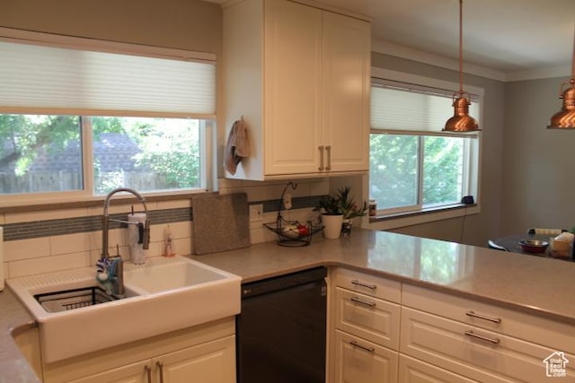 1268 E Edenbrook Dr, Sandy, UT 84094 - kitchen featuring black dishwasher, backsplash, healthy amount of natural light, white cabinetry, and ornamental molding